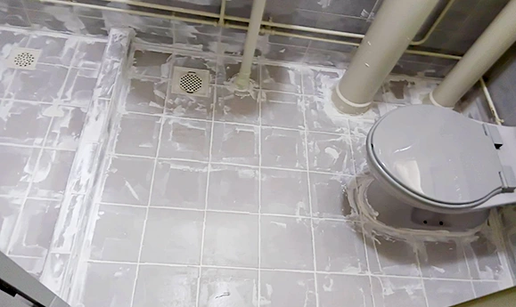 Cementitious waterproofing treatment